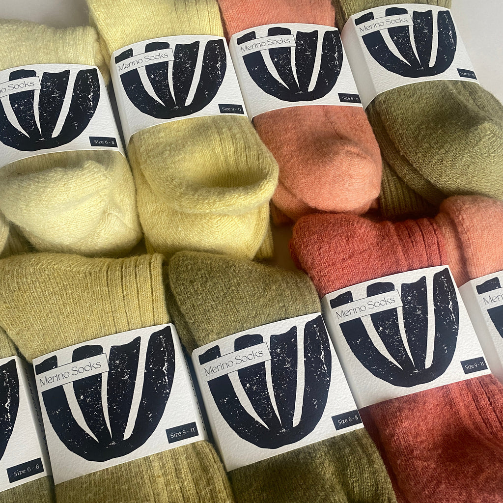 Colorful socks with brand labels on a white background